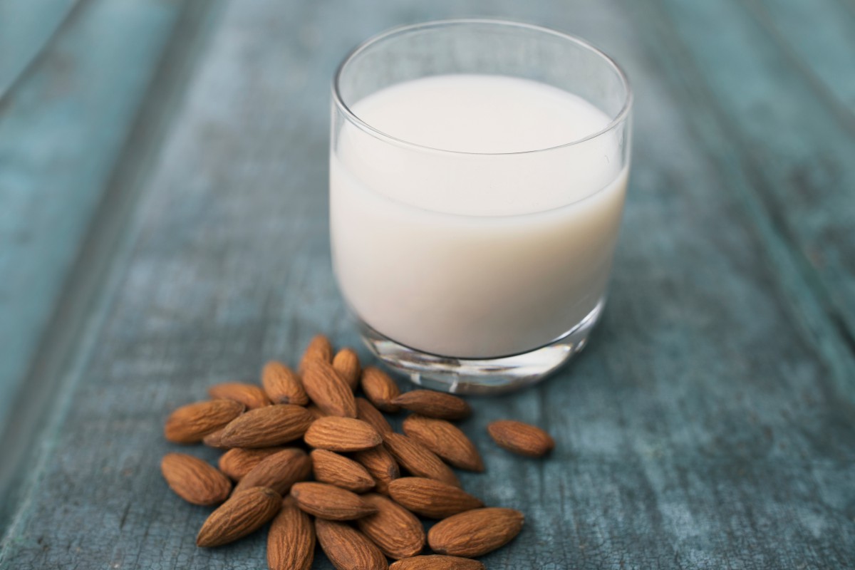 Smacking down plant milk censorship 1 Glass of milk next to almonds