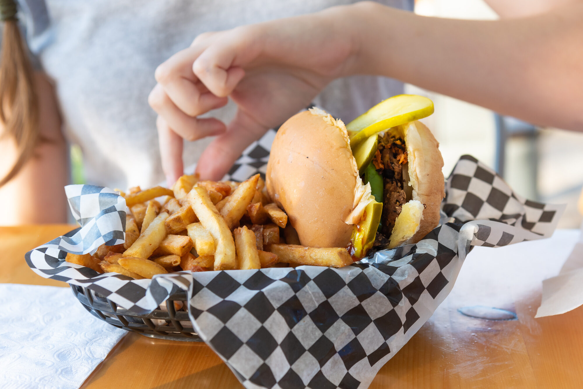 Colorado goes plant-based 1 Plant-based burger with fries on checkered paper in a food service context