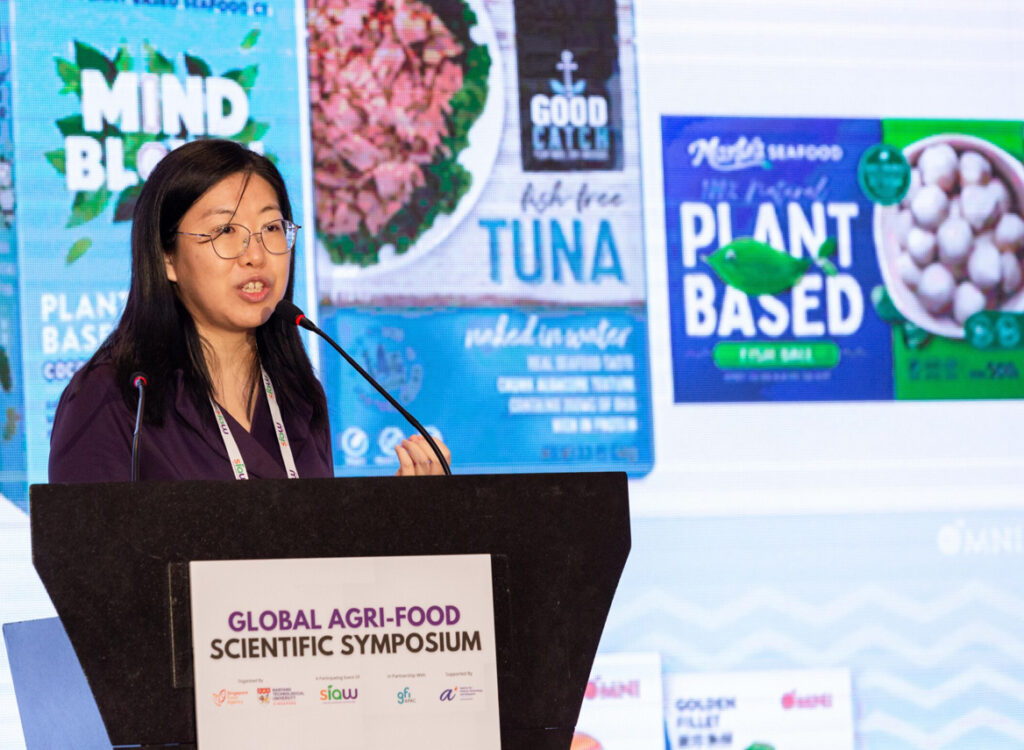 Year in review 2022 26 A woman presenting on stage at the singapore international agri-food week event