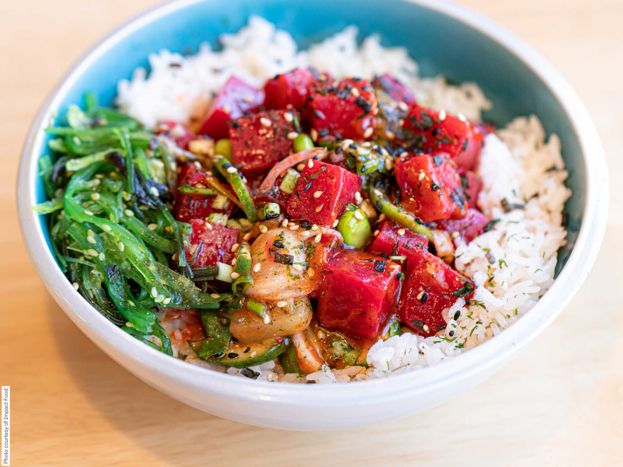 A bowl of plant-based salmon on a bed of rice