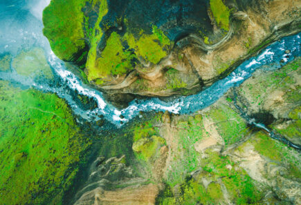 An aerial view of a river and mountains