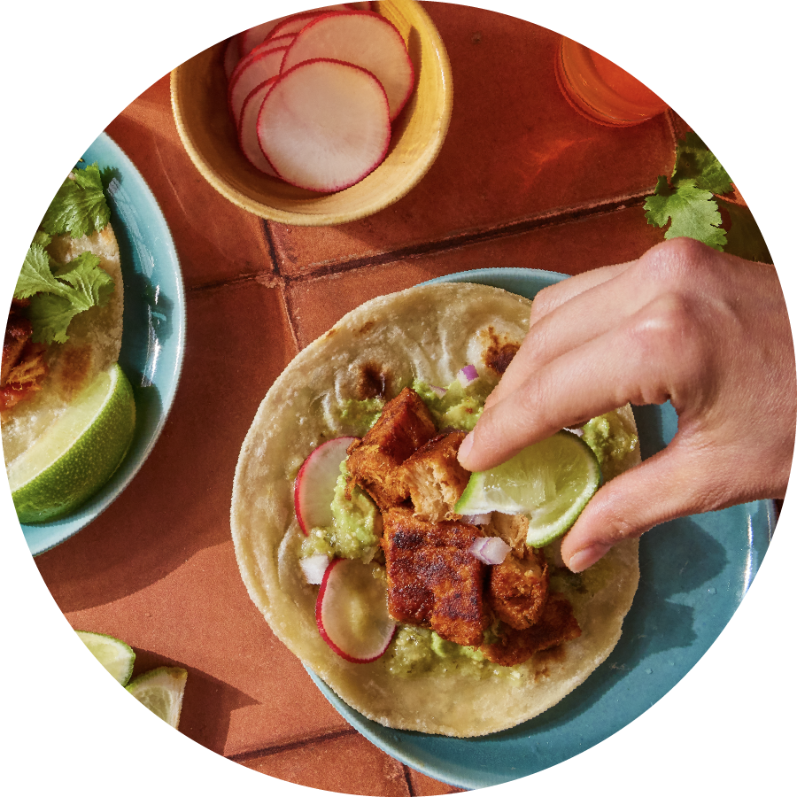An overhead view of plates of plant-based tacos. Photo credit: tender foods.