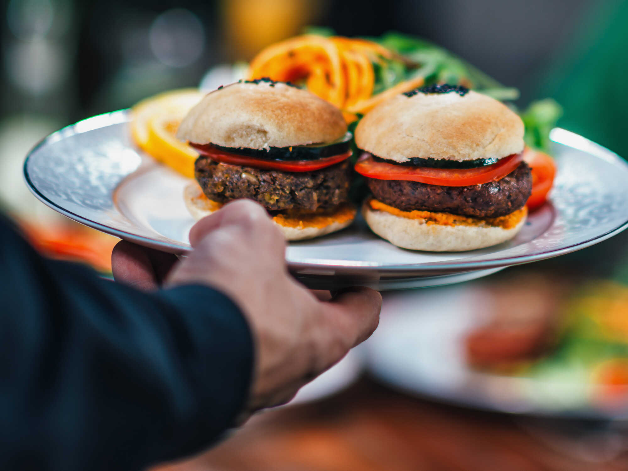 The business of alt protein: building successful relationships with foodservice companies 1 A close up view of two plant-based burger patties on a serving platter