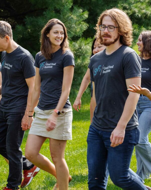 Meet our new vice president of science and technology 3 Dr. liz specht walking and talking with gfi president and founder bruce friedrich and other gfi us colleagues