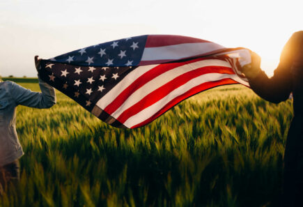 An american flag over a field